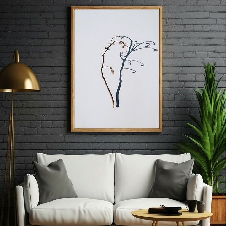 Wadi Home minimalist botanical branch wall art in brown and deep blue on white background, framed in light wood.