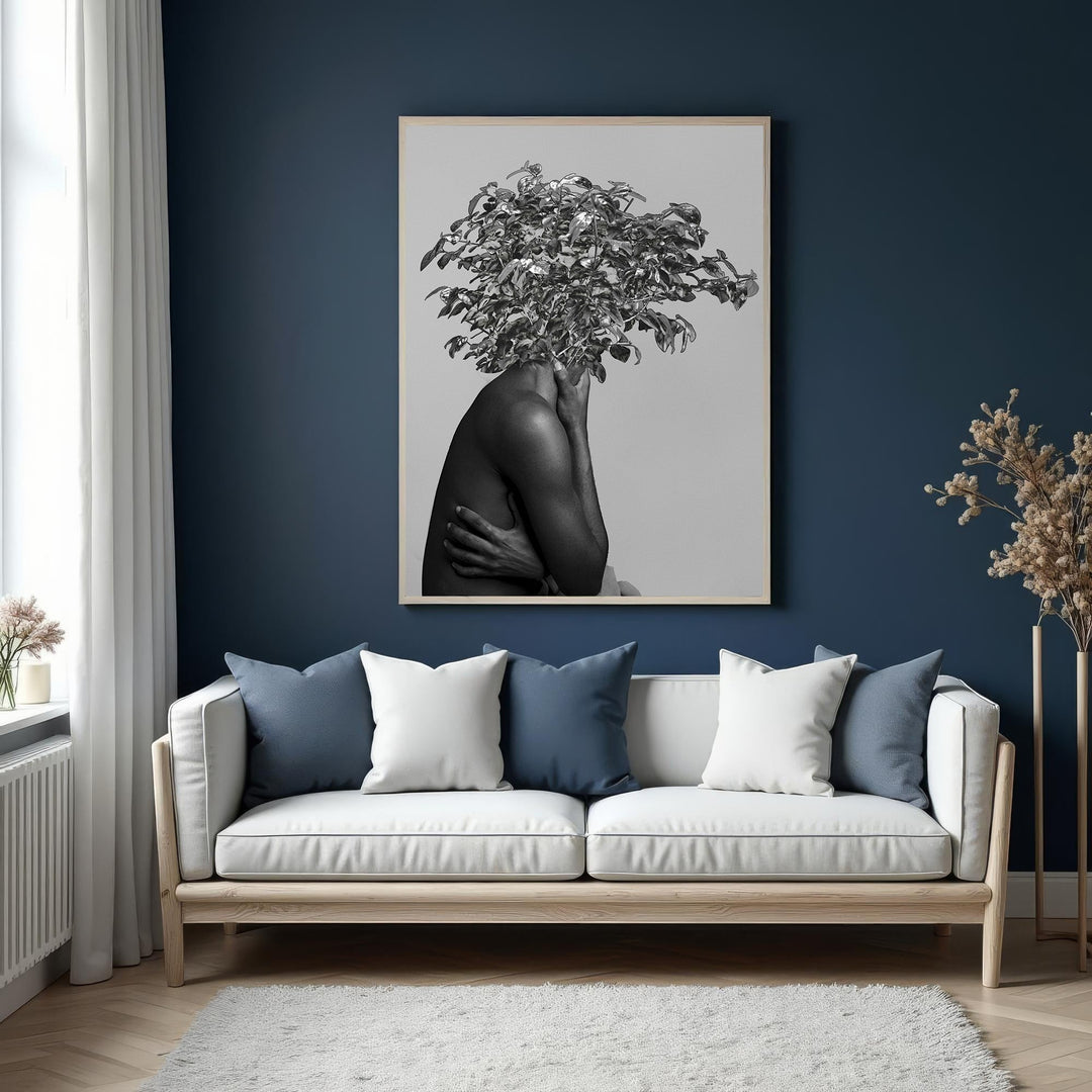 Wadi Home monochrome wall art of a figure with a lush botanical crown, arms crossed.