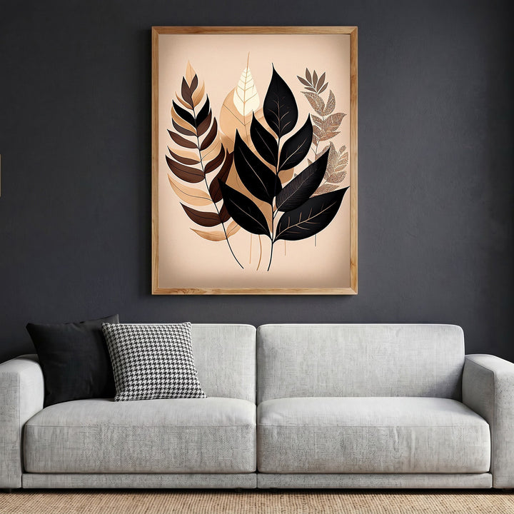 Wadi Home botanical leaf illustration wall art in a light wood frame hanging above a modern grey sofa.