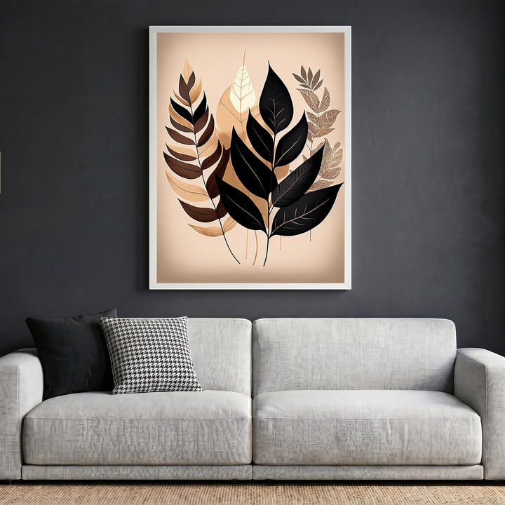 Wadi Home botanical leaf illustration wall art in black, mocha, and cream, displayed in a white frame above a sofa.