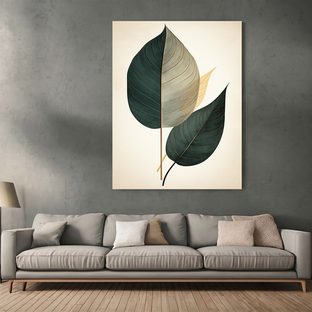 Wadi Home botanical leaf wall art print with teal and gold leaves on a cream background above a modern grey sofa.