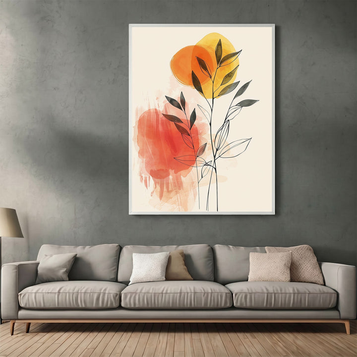 Wadi Home framed botanical line art print with orange and yellow watercolor accents hanging above a grey sofa.