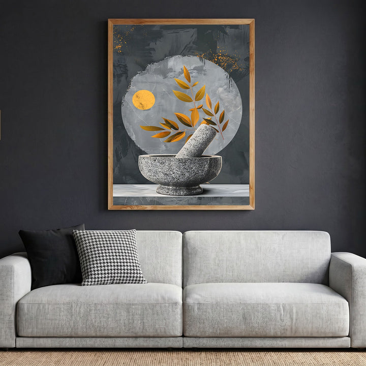 Wadi Home abstract botanical mortar and pestle wall art print with gold accents in a wooden frame above a grey sofa.