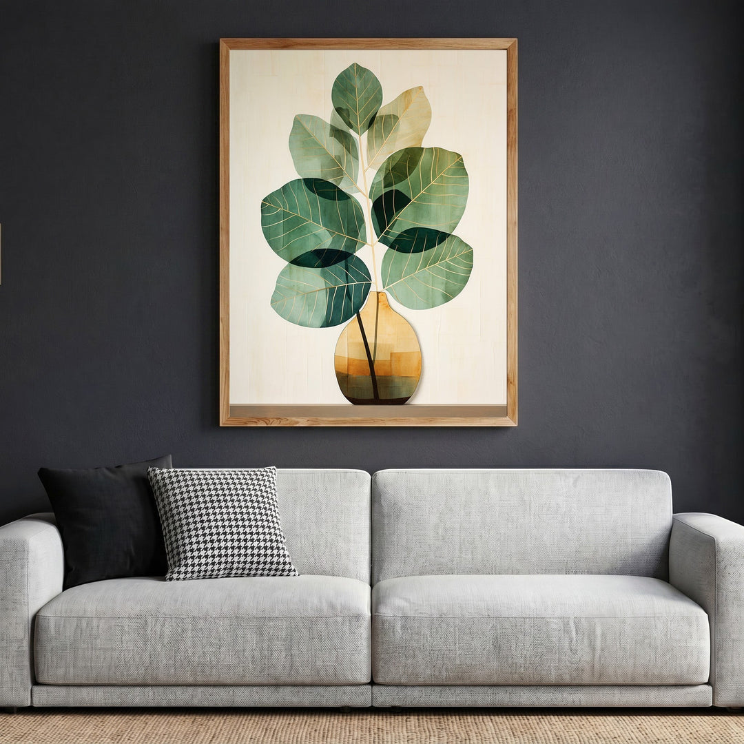 Wadi Home botanical plant wall art in a natural wood frame hanging above a modern grey sofa in a living room.