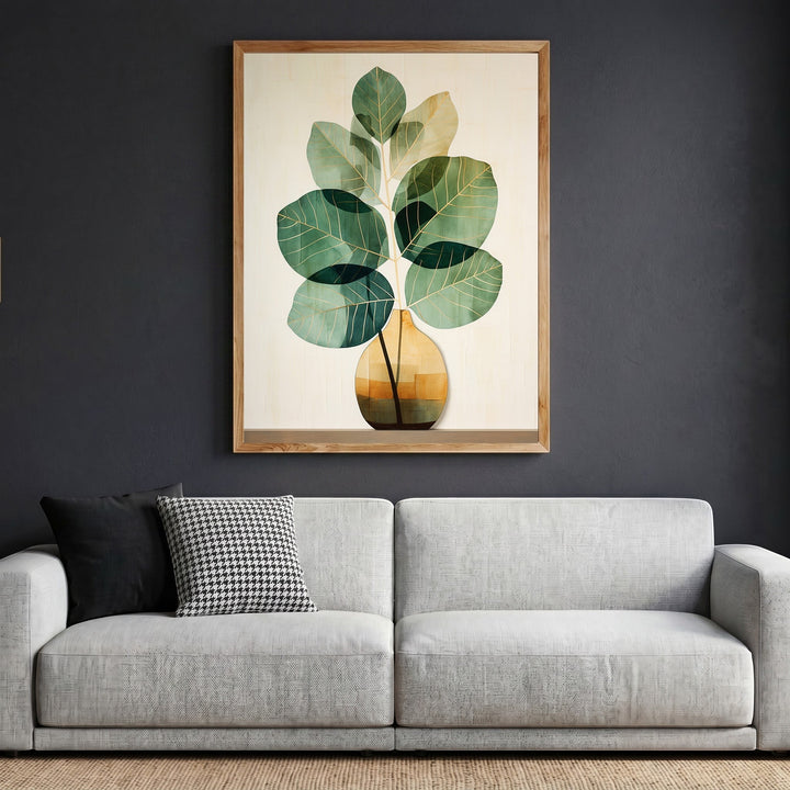 Wadi Home botanical plant wall art in a natural wood frame hanging above a modern grey sofa in a living room.