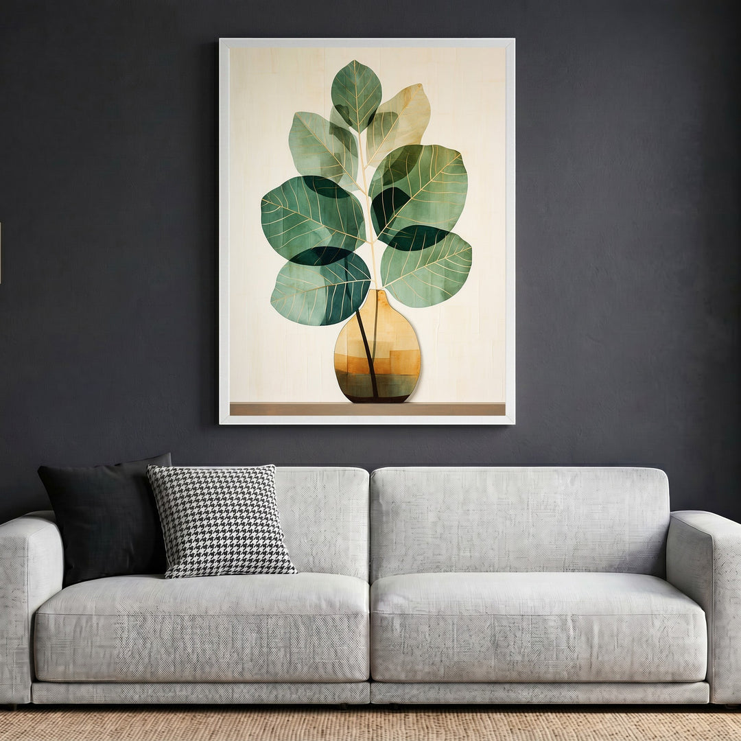 Wadi Home botanical plant wall art in a white frame hanging above a modern grey sofa in a minimalist living room.