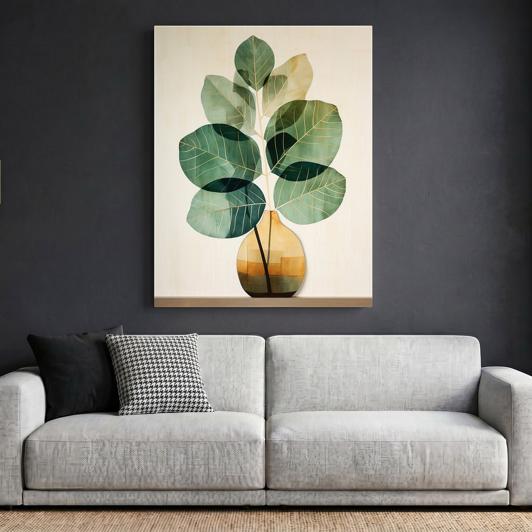 Wadi Home botanical plant wall art print featuring green foliage in a geometric vase hanging above a modern sofa.
