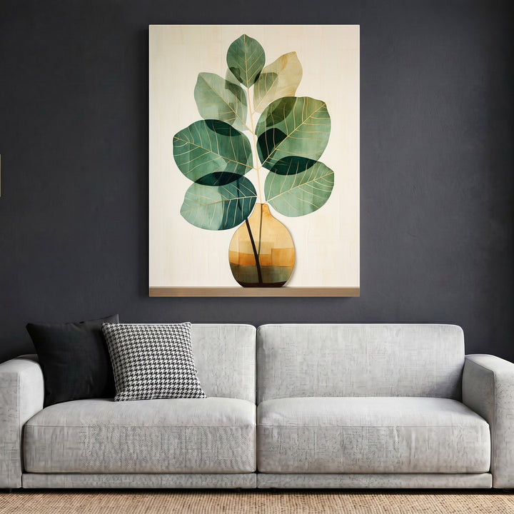 Wadi Home botanical plant wall art print featuring green foliage in a geometric vase hanging above a modern sofa.