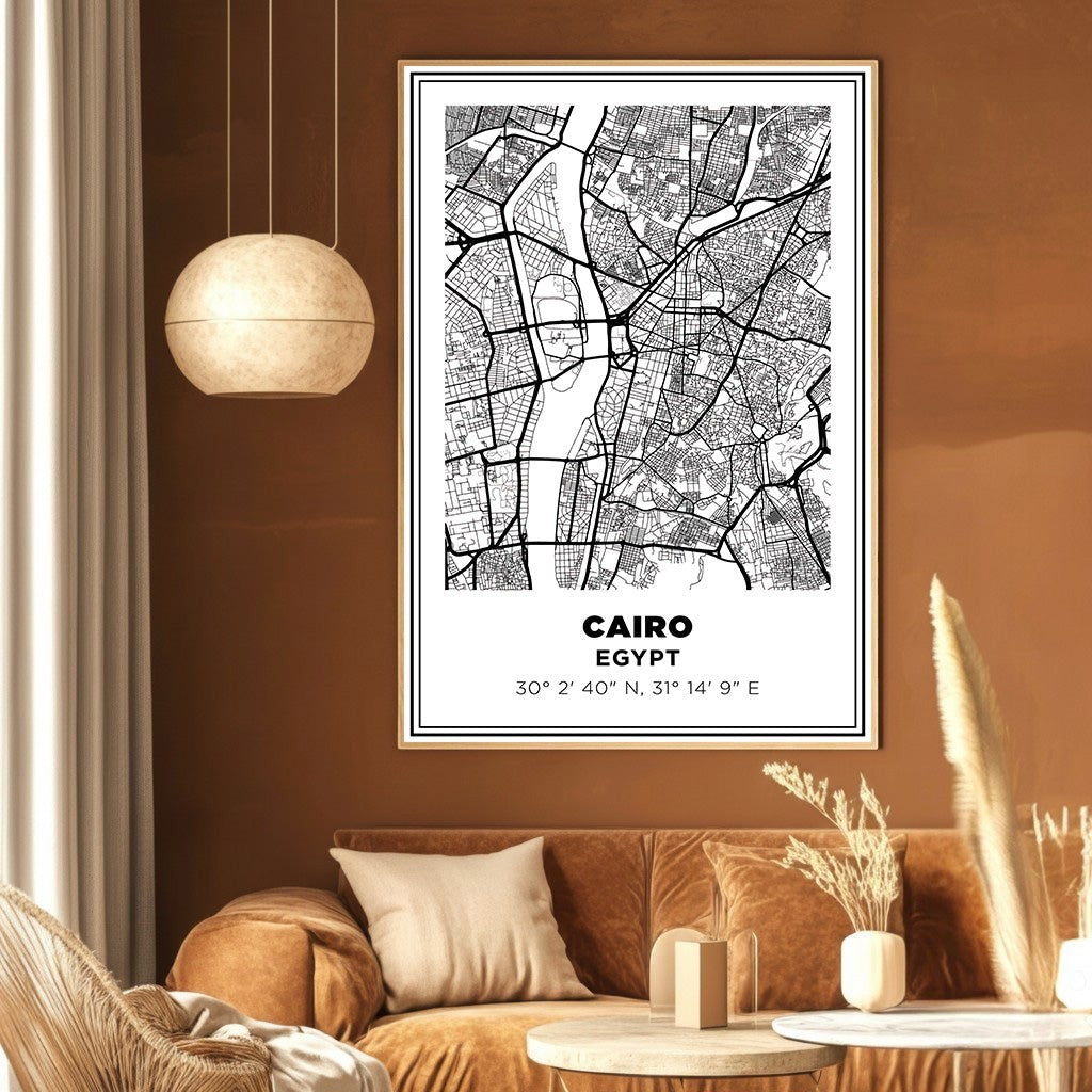 Wadi Home Cairo Egypt minimalist black and white map wall art print in a wooden frame hanging above a brown sofa.