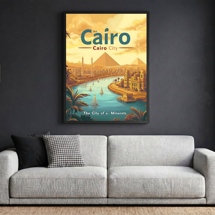 Wadi Home Cairo travel poster in a black frame hanging above a grey sofa, featuring pyramids and the Nile river.