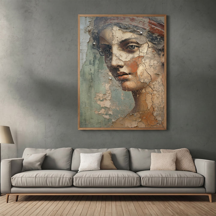 Wadi Home classical portrait wall art print with distressed fresco texture in a wooden frame above a grey sofa.