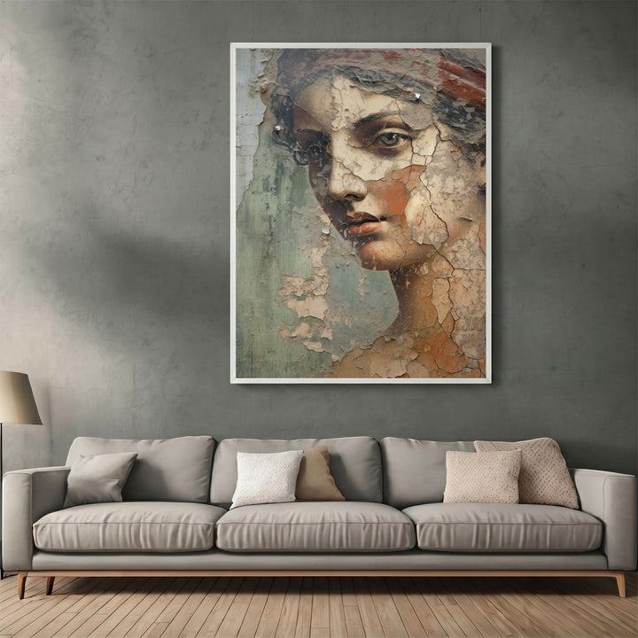 Wadi Home classical portrait wall art print with a distressed fresco texture hanging above a modern grey sofa.