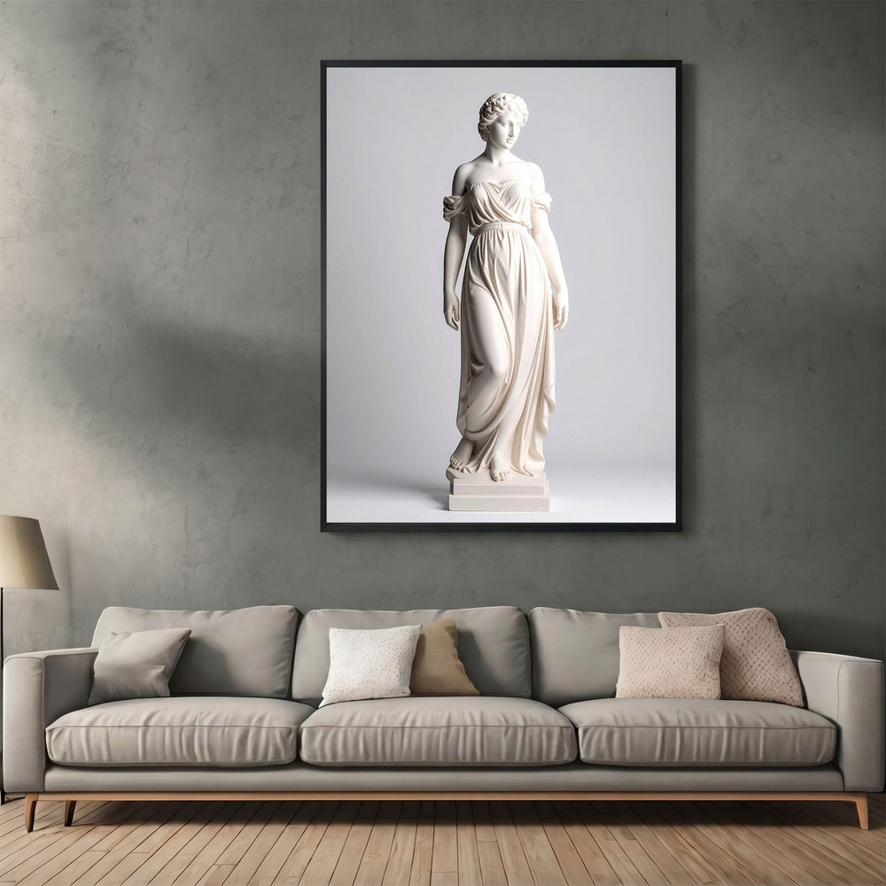 Wadi Home classical statue wall art print in a black frame hanging above a modern grey sofa in a living room.