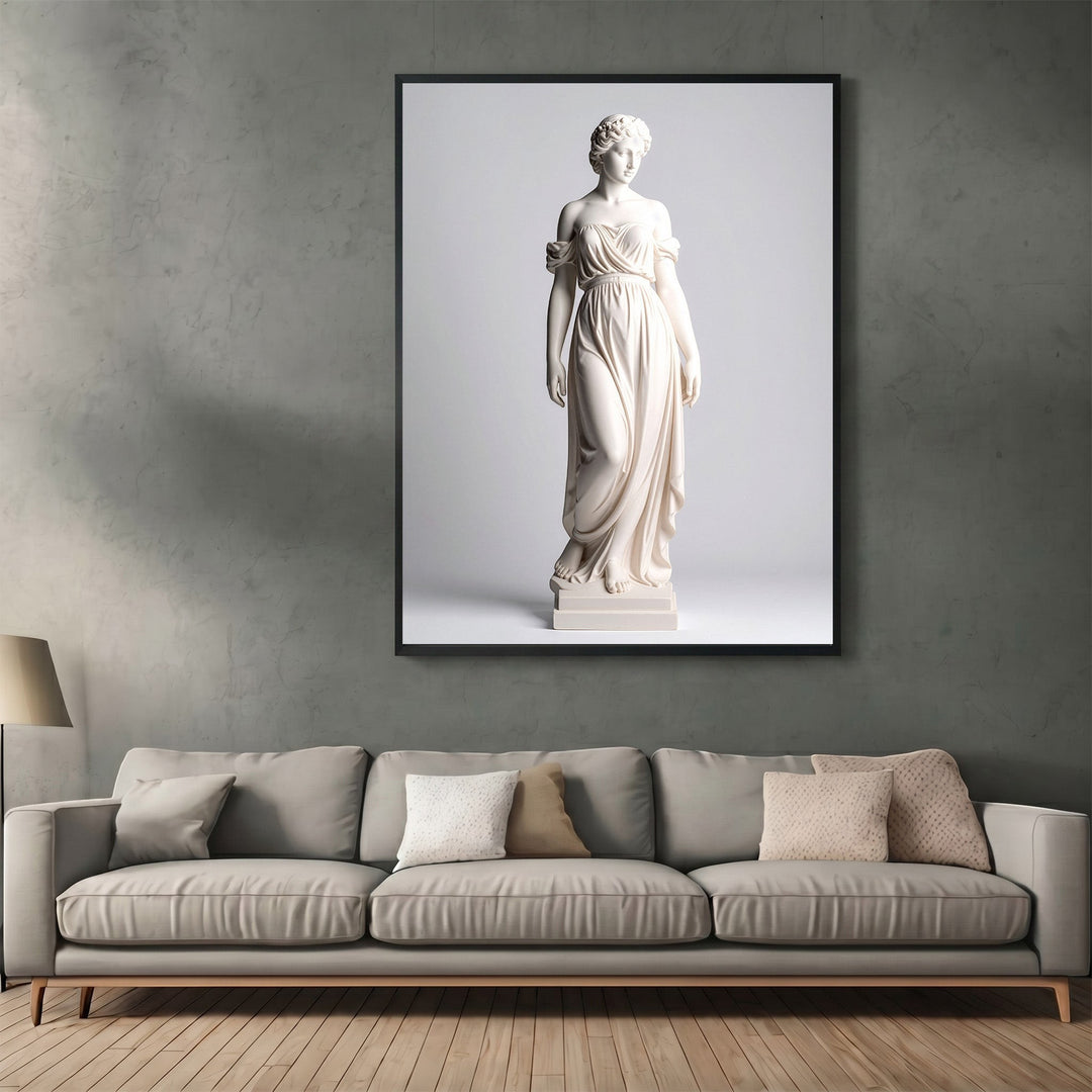 Wadi Home classical statue wall art print in a black frame hanging above a modern grey sofa in a living room.