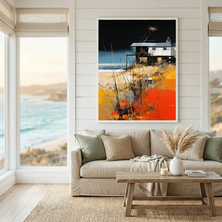 Wadi Home coastal landscape abstract wall art print featuring a beach house with orange and black tones above a sofa.