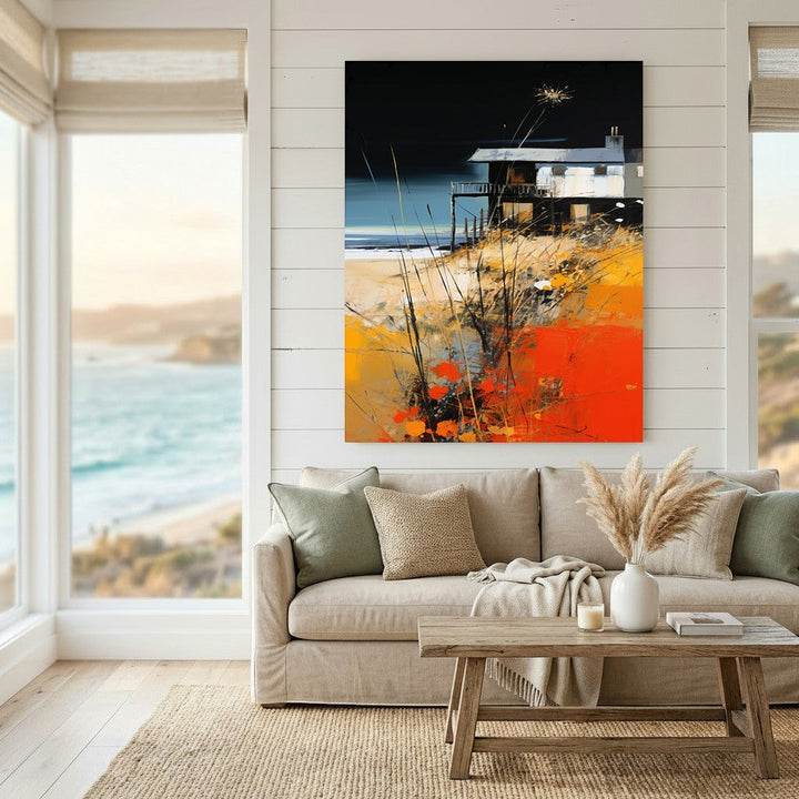 Wadi Home coastal landscape abstract wall art print featuring a beach house with orange and black tones above a sofa.