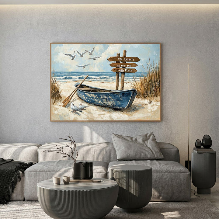 Wadi Home coastal beach wall art featuring a blue rowboat, seagulls, and a sign on a sandy shore in a modern living room.