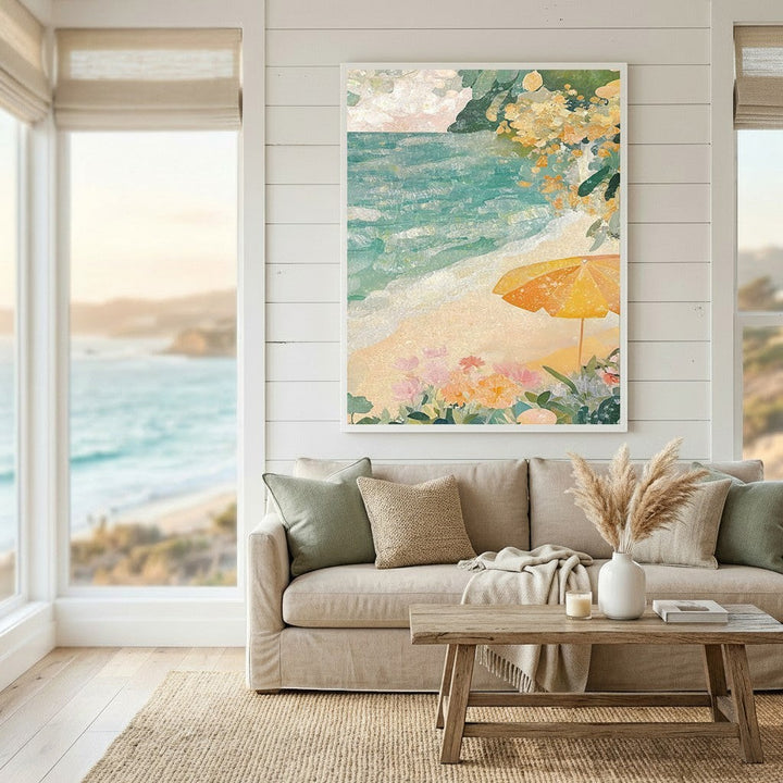 Wadi Home coastal beach scene framed wall art with turquoise ocean and yellow umbrella above a neutral living room sofa