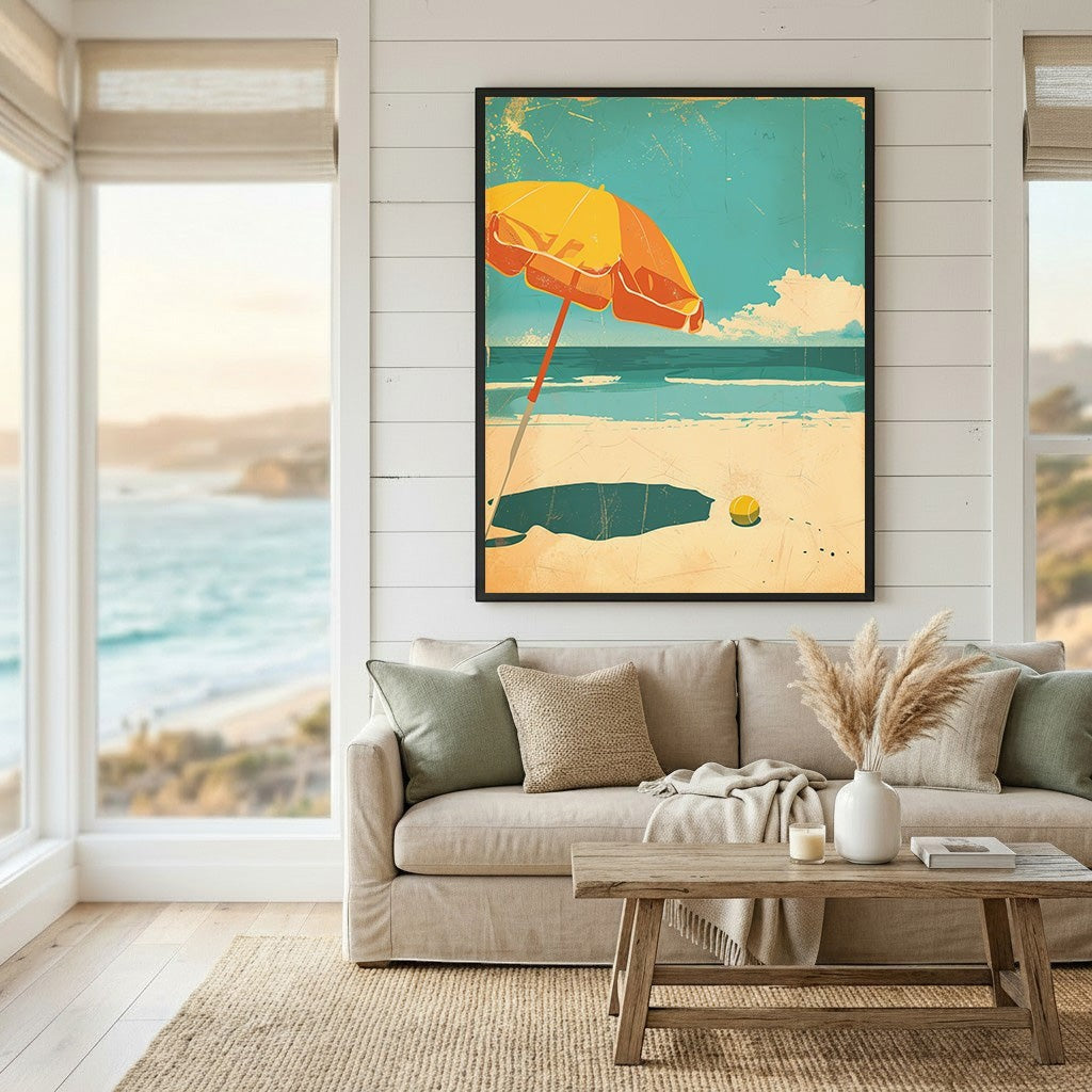 Wadi Home framed coastal beach art print with a yellow umbrella above a sofa in a bright living room.