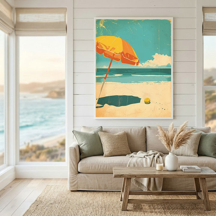 Wadi Home coastal beach scene framed wall art with a retro yellow umbrella illustration hanging in a living room.