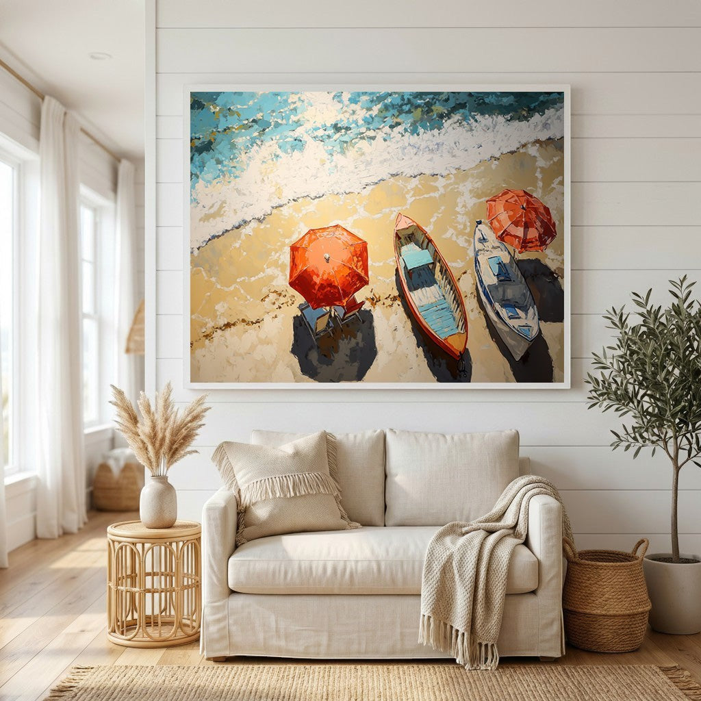 Wadi Home coastal beach scene framed wall art featuring colorful rowboats and umbrellas above a beige sofa in a room.