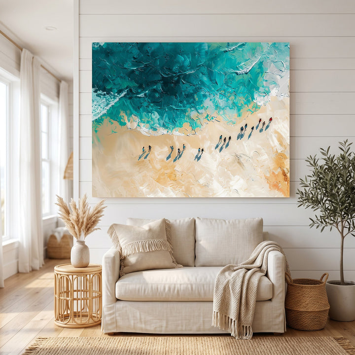 Wadi Home coastal beach oil painting with textured impasto teal ocean and sandy beige tones hanging above a sofa.