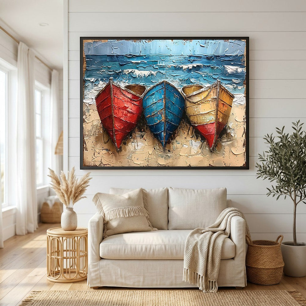 Wadi Home textured canvas wall art featuring red, blue, and yellow boats on a sandy beach above a neutral living room.