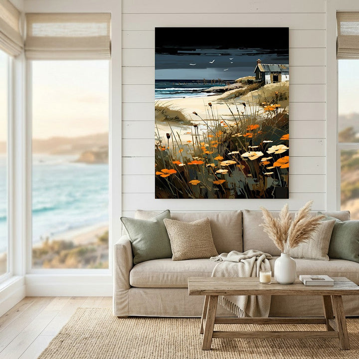 Wadi Home coastal landscape wall art print featuring orange wildflowers and a moody sky above a beige living room sofa.