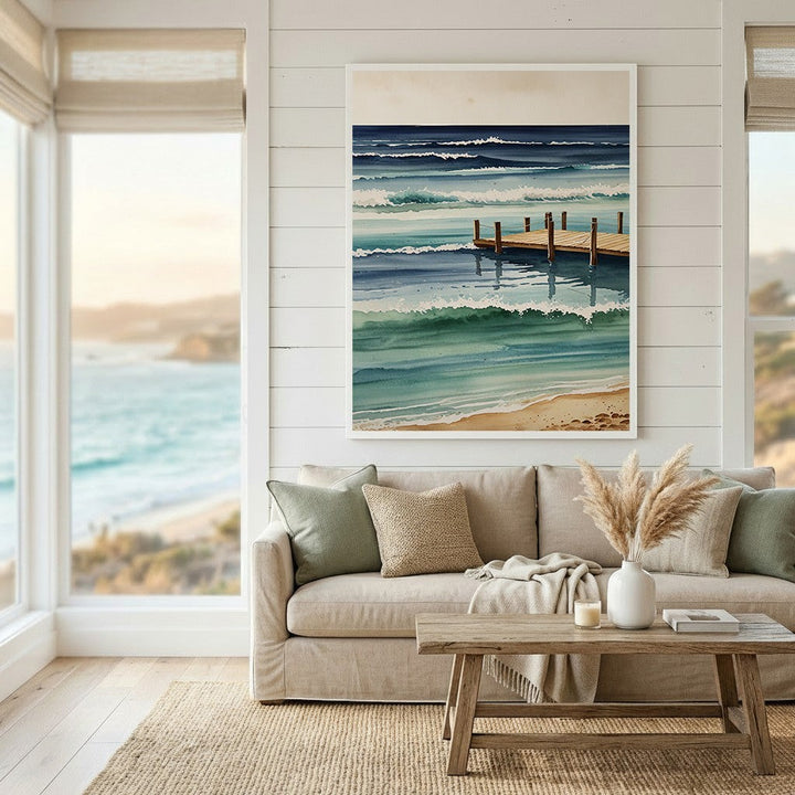 Wadi Home watercolor coastal pier wall art print featuring ocean waves in blue and teal tones above a neutral sofa.