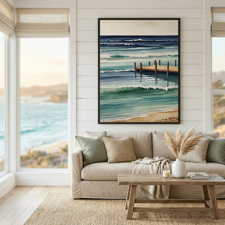 Wadi Home watercolor coastal pier ocean waves wall art print hanging above a beige sofa in a bright living room.