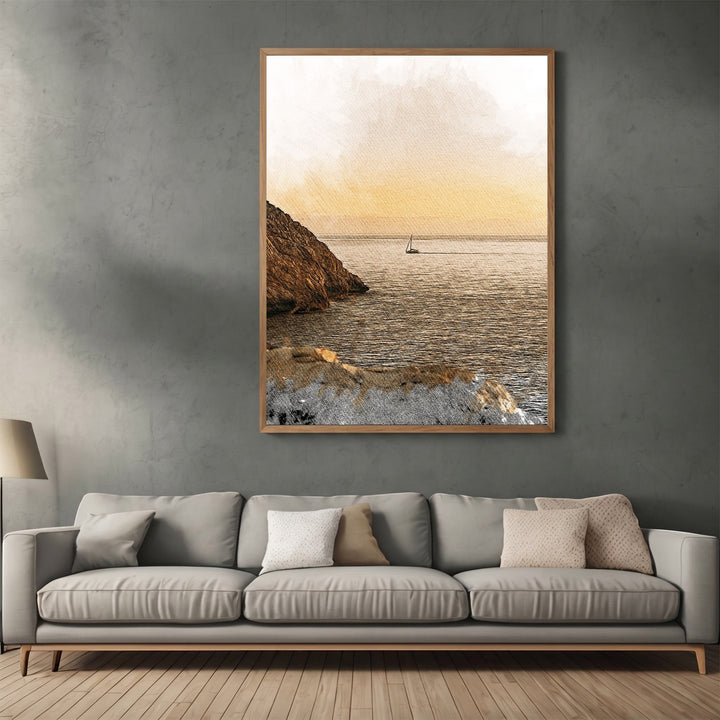 Wadi Home coastal sailboat landscape wall art in a wooden frame hanging above a modern grey sofa in a living room.