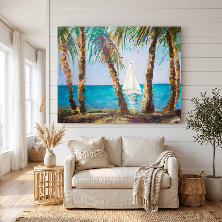 Wadi Home coastal sailboat landscape canvas art featuring palm trees and turquoise water above a neutral living room sofa.