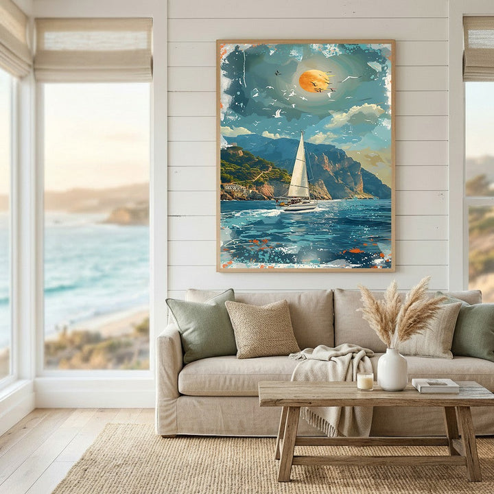 Wadi Home coastal sailboat landscape wall art print featuring a sunlit sea and cliffs hanging above a neutral sofa.