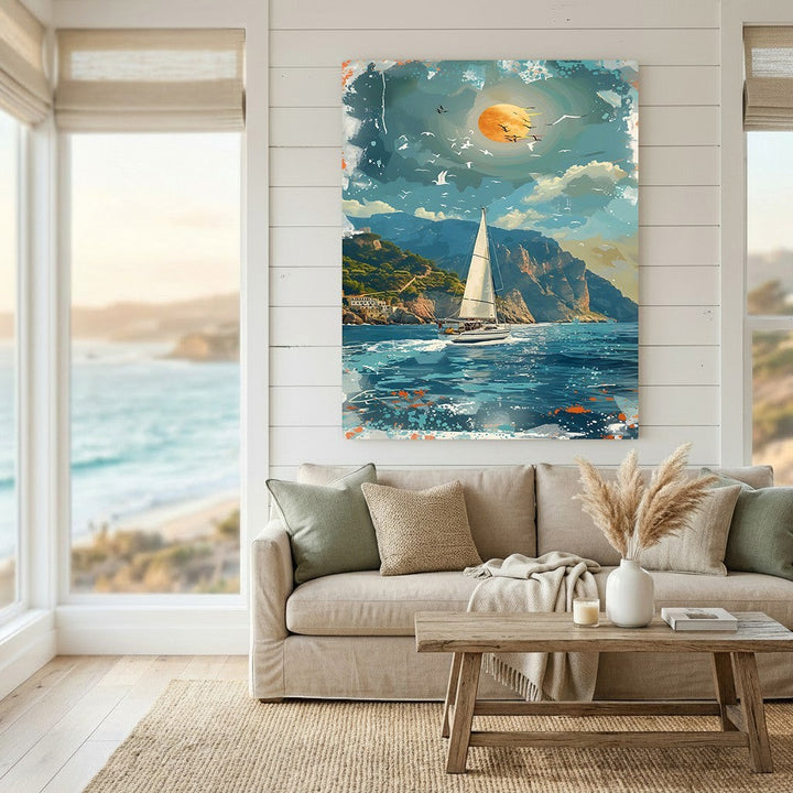 Wadi Home coastal sailboat landscape wall art print featuring a sunlit sea and cliffs above a neutral living room sofa.