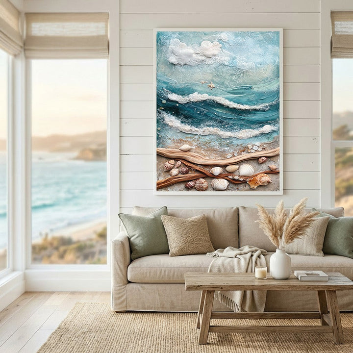 Wadi Home coastal seascape wall art with textured turquoise waves, sandy beach, and seashells above a neutral sofa.
