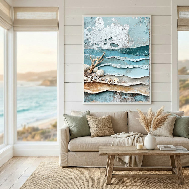 Wadi Home coastal shoreline textured wall art featuring blue and beige layers with driftwood and seashells in a living room.