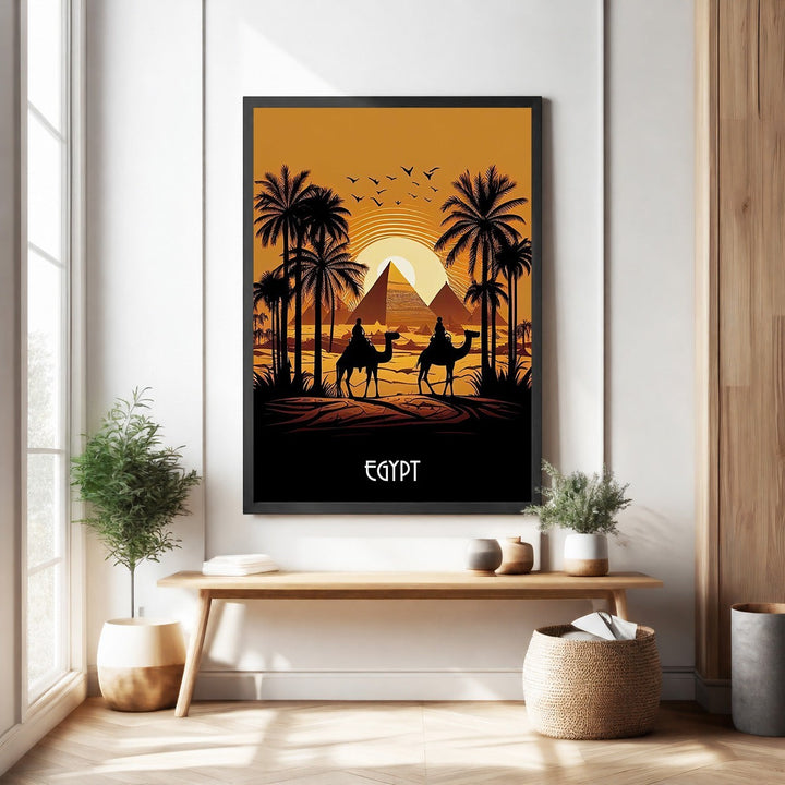 Wadi Home wall art depicting a desert sunset scene with Egyptian pyramids, palm trees, and two camels.