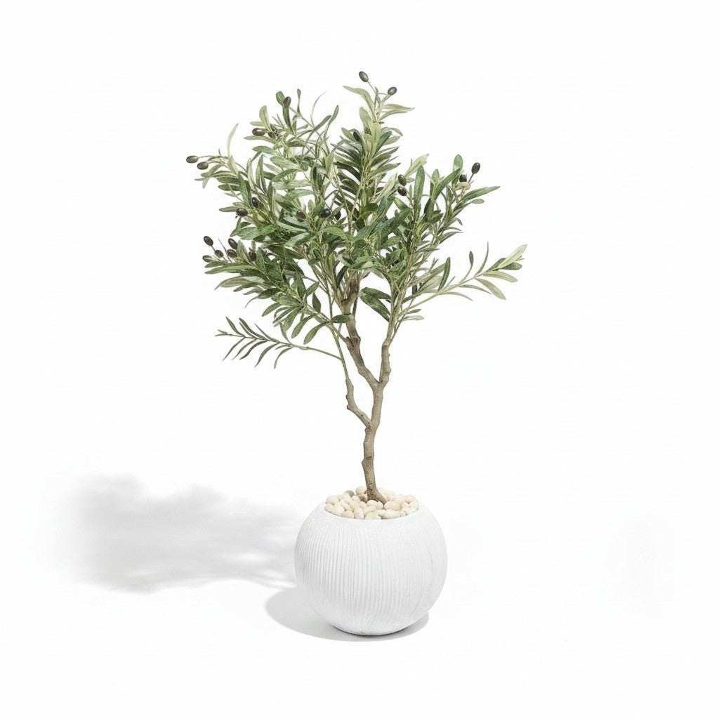 Wadi Home faux olive tree with realistic green leaves and dark olives in a textured white planter with white stones.