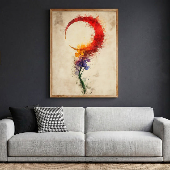 Wadi Home abstract floral crescent moon wall art print in a wooden frame hanging above a modern grey sofa.