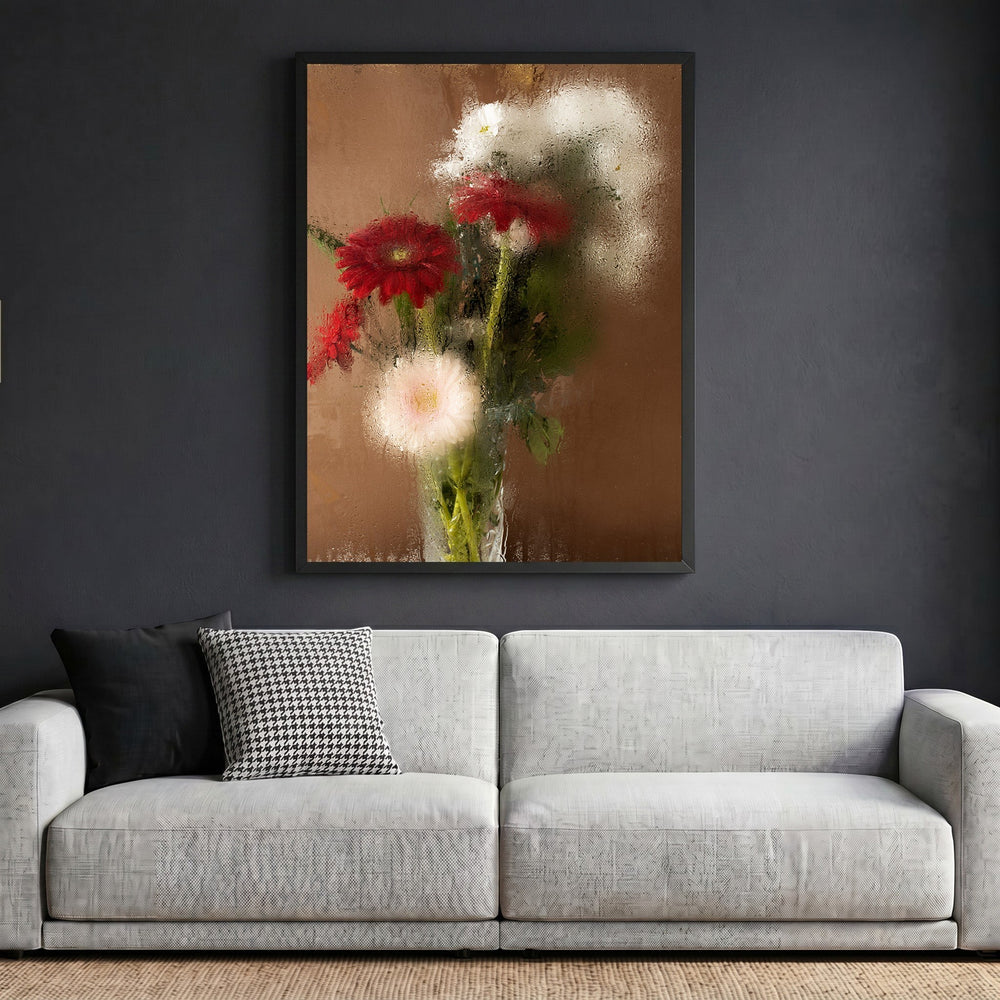 Wadi Home floral still life framed wall art with red and white flowers on a brown background, hanging above a sofa.