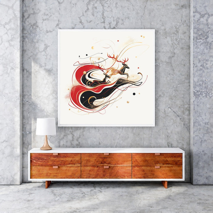 Wadi Home framed abstract art print featuring leaping deer in red, black, and gold on a cream background.