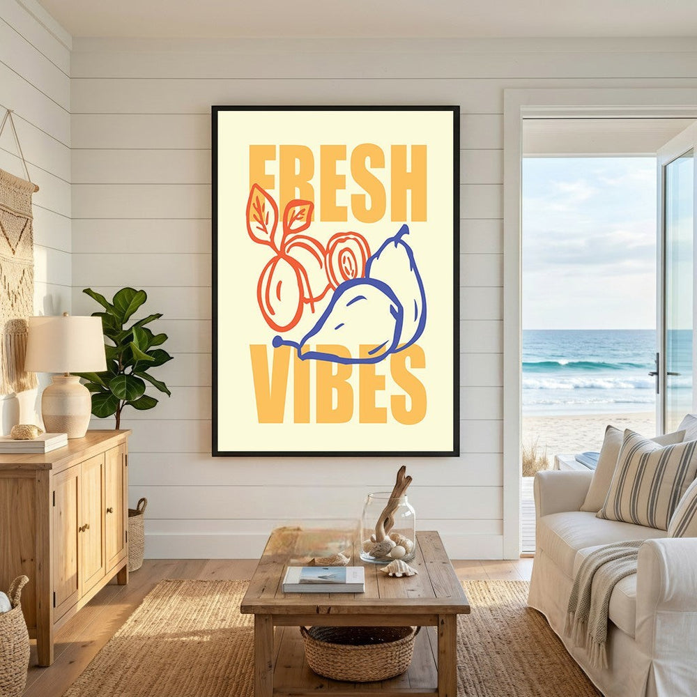 Wadi Home Fresh Vibes wall art print with stylized fruit illustrations in yellow, orange, and blue in a coastal room.