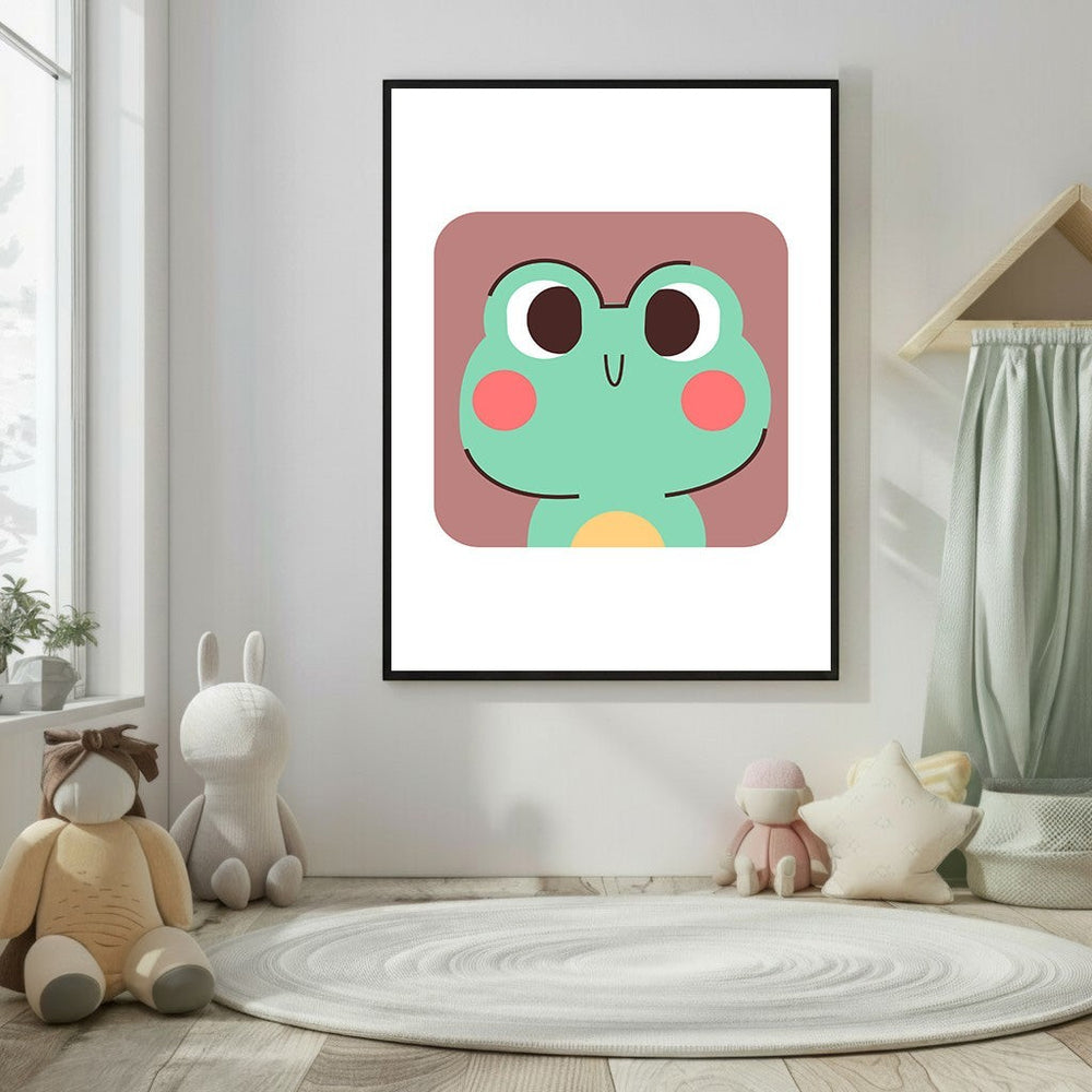 Wadi Home cute green frog face nursery art with pink cheeks and a yellow belly, framed in black.