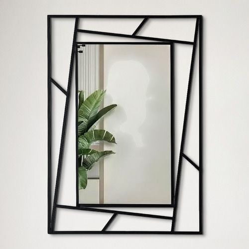 Wadi Home rectangular wall mirror with a modern matte black geometric metal frame and intersecting lines.