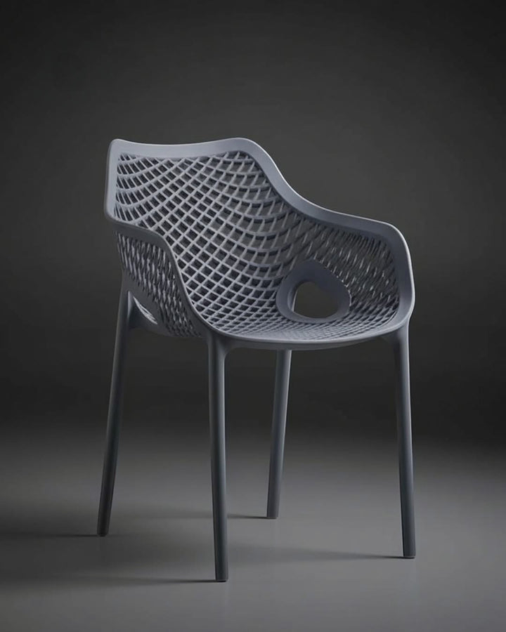 Wadi Home modern grey armchair featuring an intricate lattice pattern, ergonomic armrests, and a durable minimalist design.