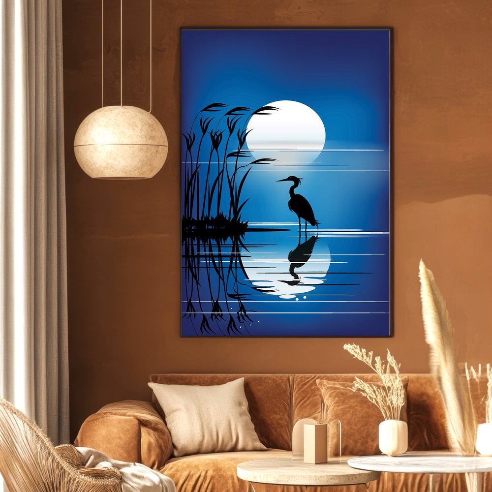 Wadi Home heron silhouette wall art print featuring a blue moonlit scene with reeds, displayed in a modern living room.