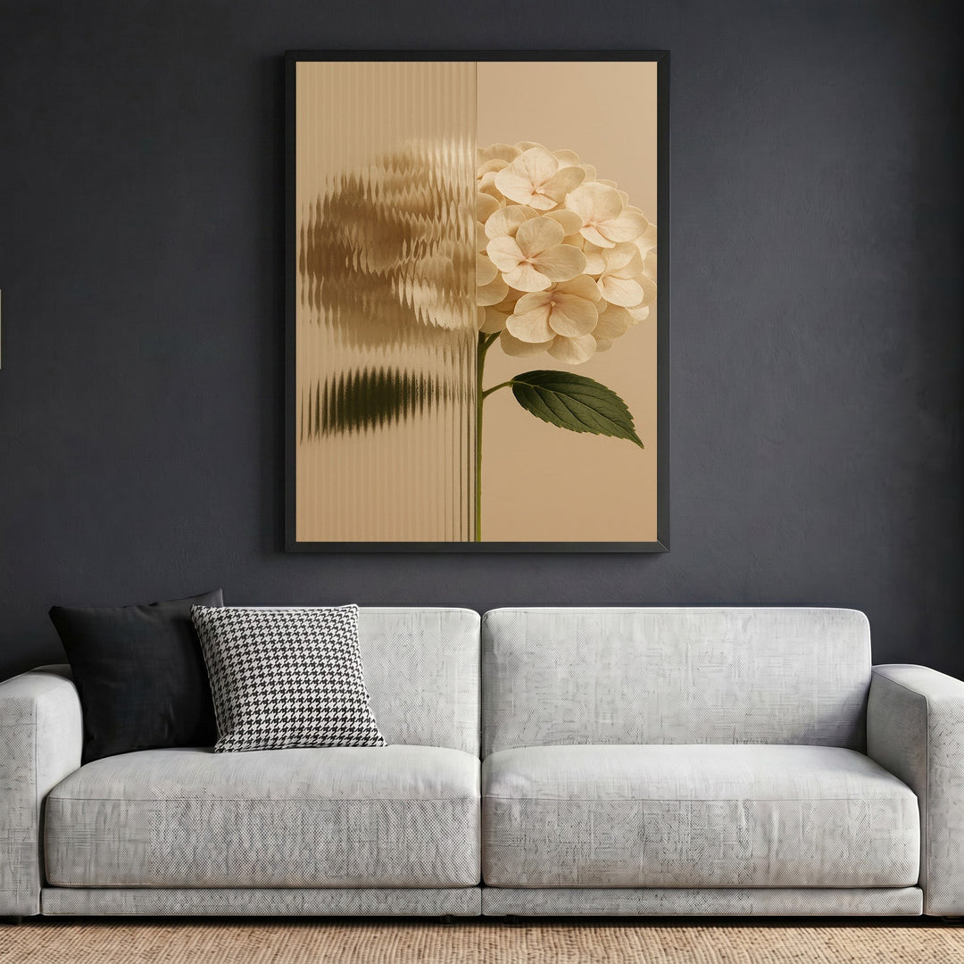 Wadi Home hydrangea botanical wall art print with fluted glass effect in a black frame above a modern grey sofa.