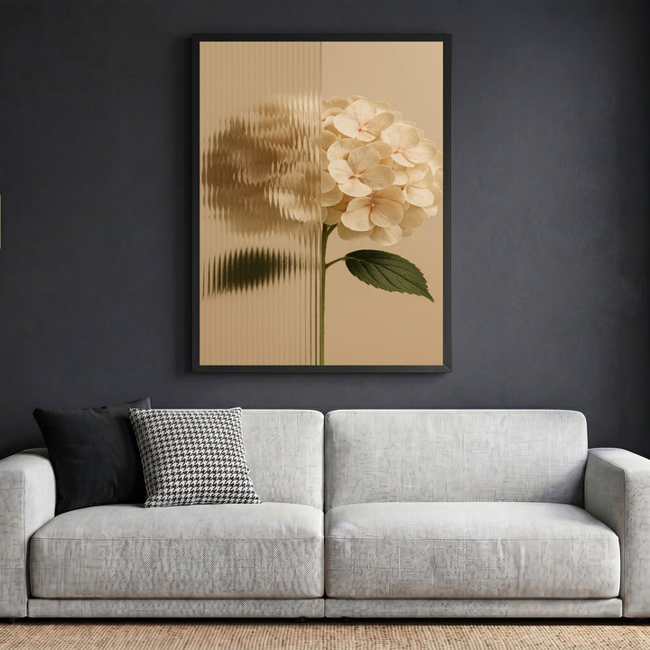 Wadi Home hydrangea botanical wall art print with fluted glass effect in a black frame above a modern grey sofa.