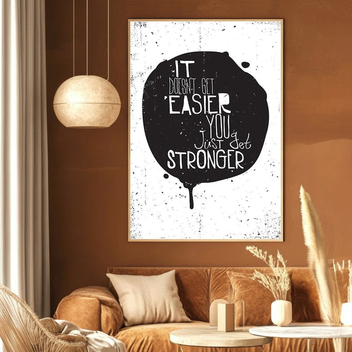 Wadi Home inspirational quote wall art with black ink-blot design and white typography in a modern living room.