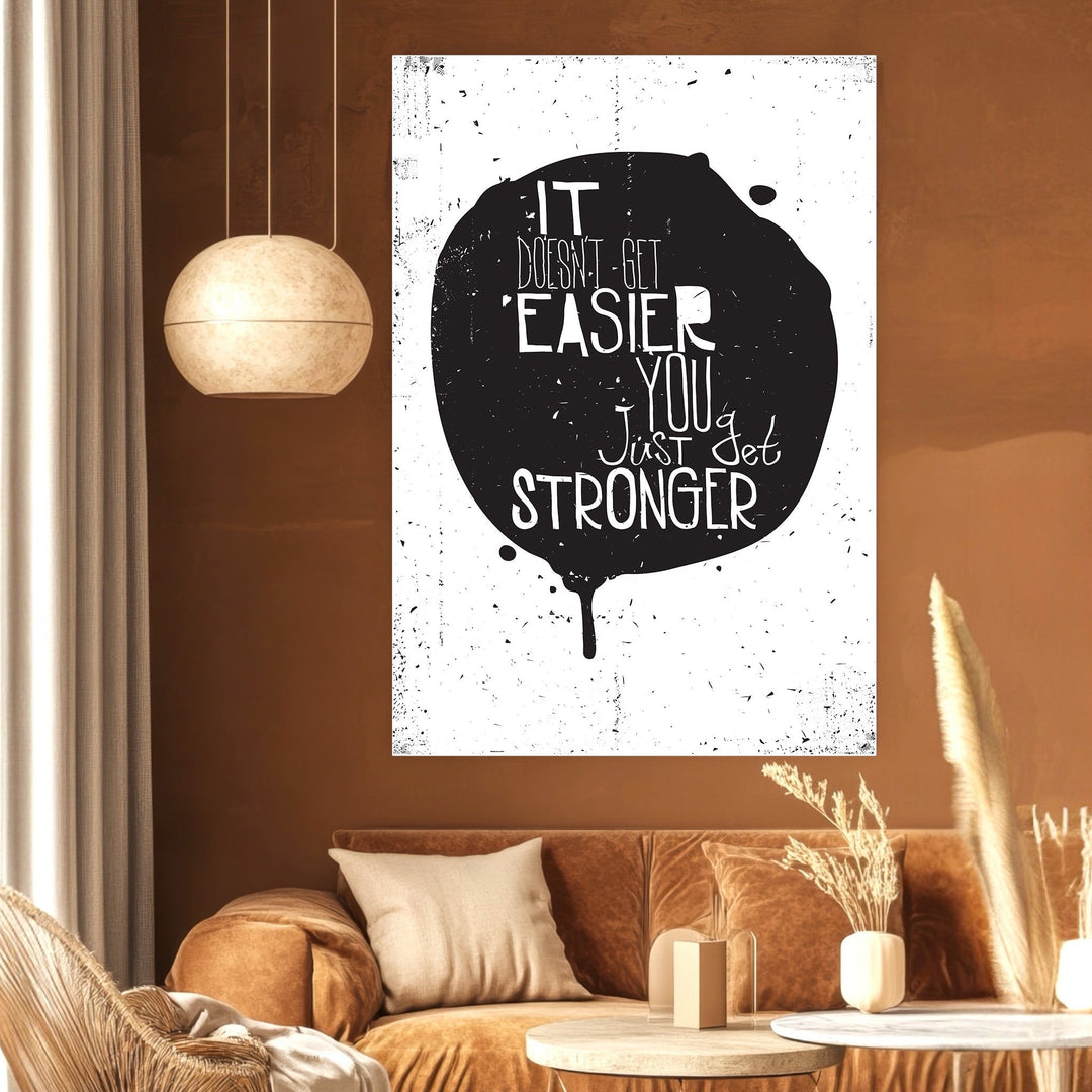 Wadi Home inspirational quote wall art print with black ink-blot design on white background in a modern living room.